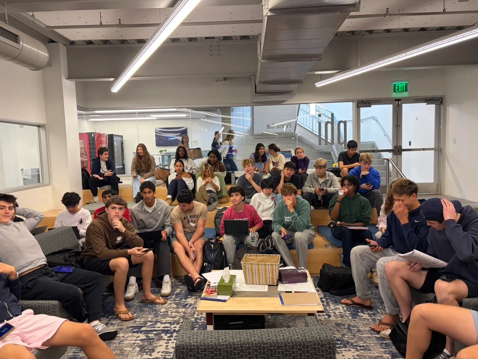 Students gathered indoors for an entrepreneurship club meeting